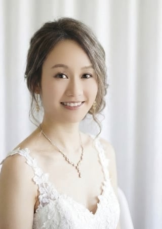 32-Sophisticated-Asian-bride-featuring-a-clean-makeup-look-and-neat-hair-styling